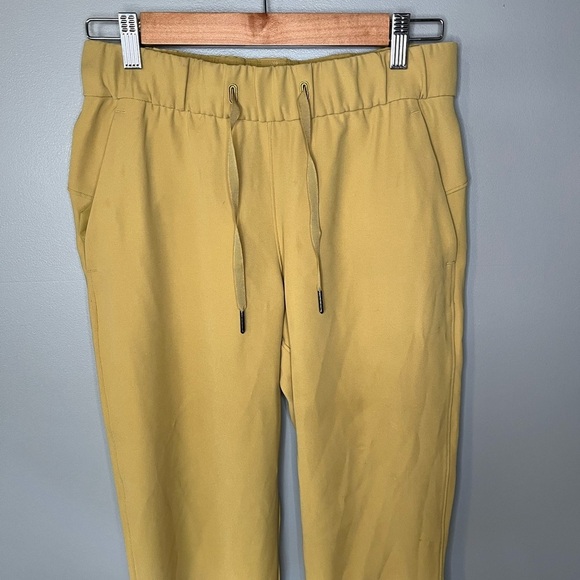 Lululemon On the Fly 7/8 Pant *Woven Vintage Gold - Picture 4 of 10